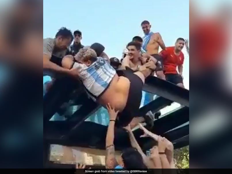 Watch: Wild Argentina Fans Celebrating World Cup Win Lift Heavy Man Atop Bus Stop