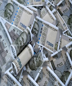Rupee opens near two week low against US dollar